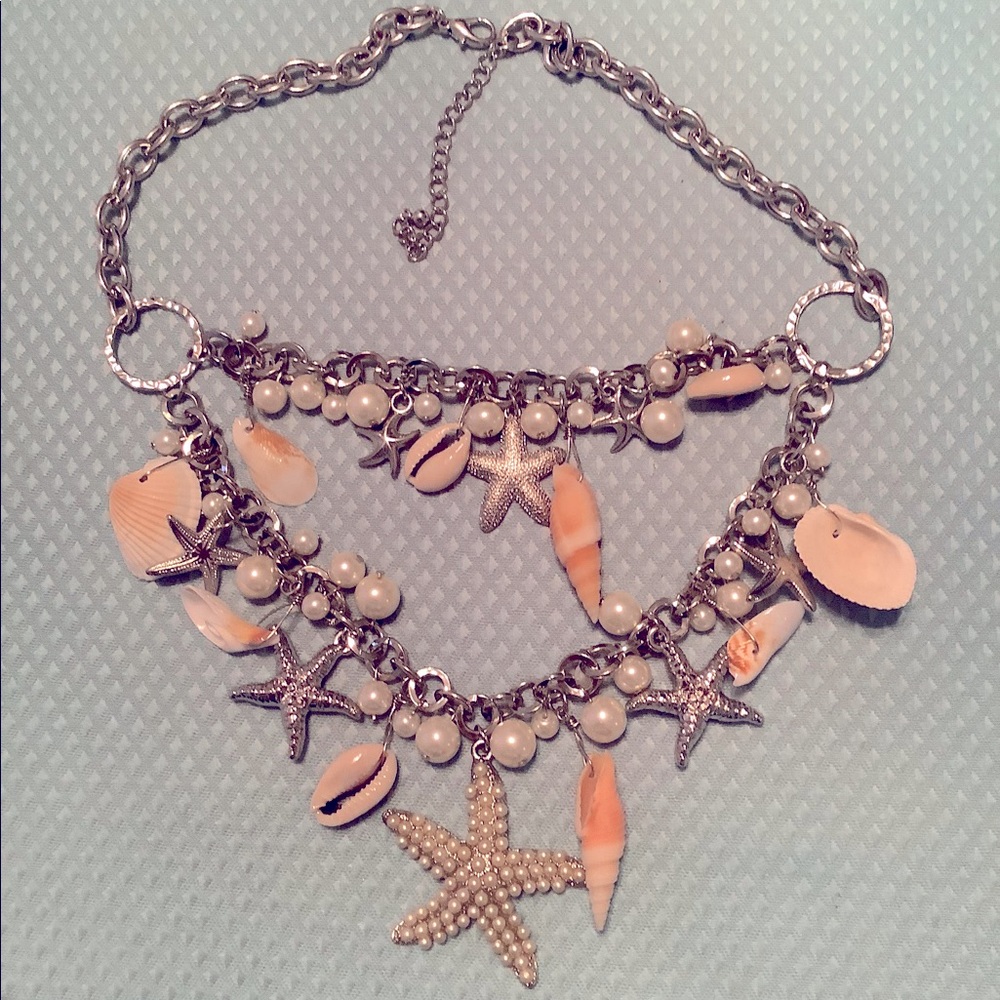 Silvertone, pearl and seashell necklace.